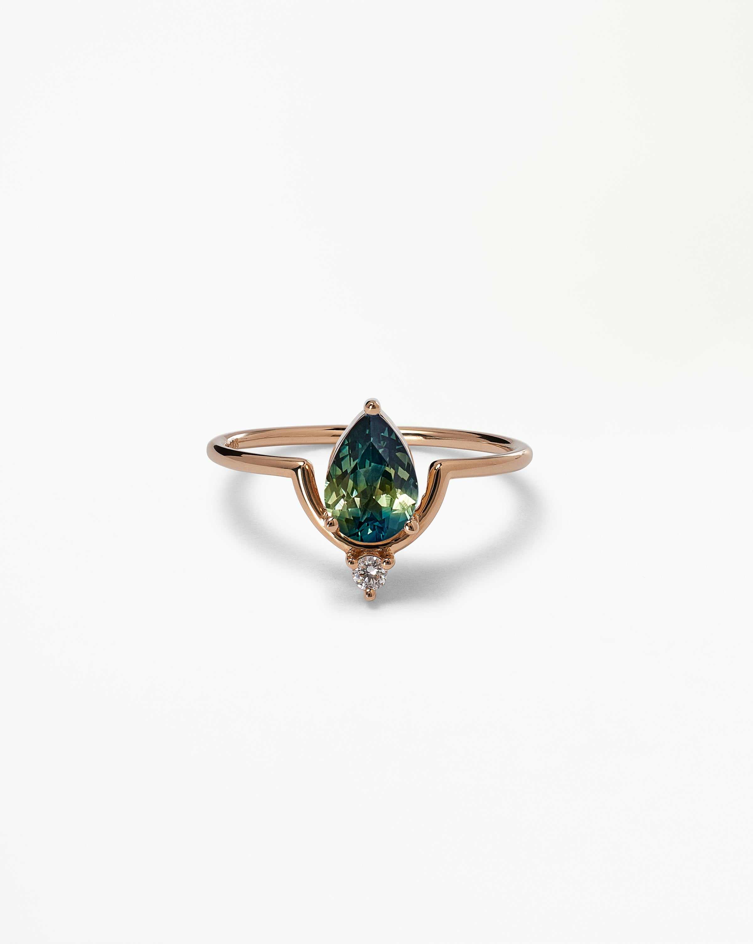 Pear Cut Sapphire Nestled Ring